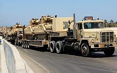 Illustrative photo of Egyptian army trucks carrying military tanks in the northern Sinai Peninsula, August 2012. (AP/File)