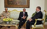 Leon Panetta (center) met with Fieldmarshal Tantawi and President Mohammed Morsi in Cairo, in July (photo credit: AP/Amr Nabil)