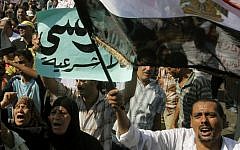 Egyptian anti-Muslim Brotherhood protesters shout slogans during a rally to denounce the country's Islamist President Mohammed Morsi in Cairo, August 2012. (photo credit: AP/Amr Nabil)
