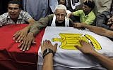 Relatives of slain Egyptian soldiers mourn during their funerals, July 7 (photo credit: AP Photo/Amr Nabil)