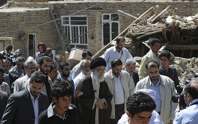 In this photo released by official website of the Iranian supreme leader's office, Iranian supreme leader Ayatollah Ali Khamenei, center, visits a village damaged by an earthquake in northwestern Iran, Thursday, Aug. 16, 2012. (AP Photo/Office of the Supreme Leader)
