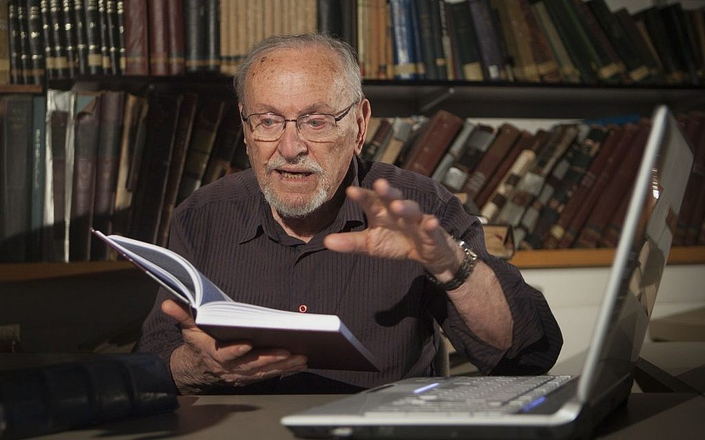 Biblical scholar Professor Menachem Cohen, reading from a book, at the Bar Ilan University library, outside Tel Aviv. (AP Photo/Dan Balilty) Biblical scholar Professor Menachem Cohen, reading from a book, at the Bar Ilan University library, outside Tel Aviv. (AP Photo/Dan Balilty)