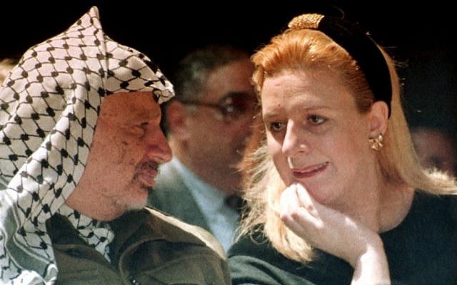 Suha Arafat, right, and late Palestinian leader Yasser Arafat attend a conference in the Gaza Strip in April, 1995 (photo credit: AP/Nabil Judah) Suha Arafat, right, and late Palestinian leader Yasser Arafat attend a conference in the Gaza Strip in April, 1995 (photo credit: AP/Nabil Judah)