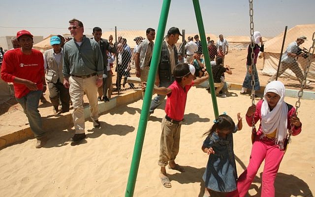 Canadian Foreign Affairs Minister John Baird, second left, visits Zaatari camp for Syrian refugees, in Mafraq, Jordan. (photo credit: AP) Canadian Foreign Affairs Minister John Baird, second left, visits Zaatari camp for Syrian refugees, in Mafraq, Jordan. (photo credit: AP)