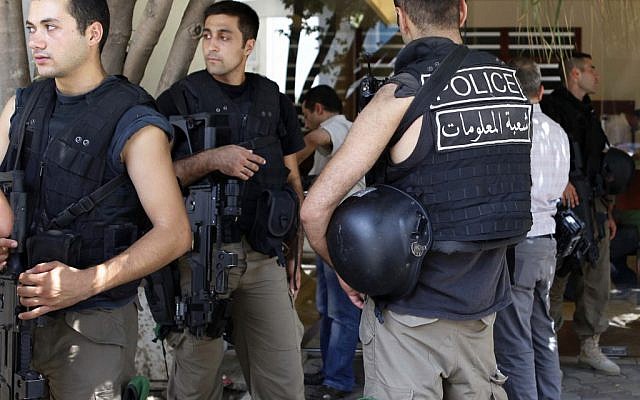 Lebanese security forces stand at the entrance building of former Lebanese Information Minister Michel Samaha on Aug. 9, 2012 as they raid his house after they arrested him. (photo credit: AP) Lebanese security forces stand at the entrance building of former Lebanese Information Minister Michel Samaha on Aug. 9, 2012 as they raid his house after they arrested him. (photo credit: AP)