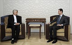 Syrian President Bashar Assad, right, meets with Saeed Jalili, secretary of Iran's Supreme National Security Council, in Damascus on August 7 (photo credit: AP/SANA)