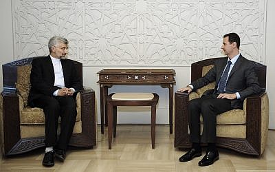 Syrian President Bashar Assad, right, meets with Saeed Jalili, secretary of Iran's Supreme National Security Council, in Damascus on August 7 (photo credit: AP/SANA)