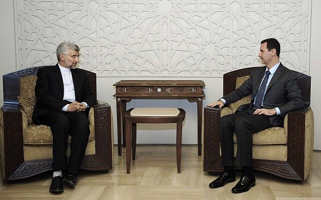 Syrian President Bashar Assad, right, meets with Saeed Jalili, secretary of Iran's Supreme National Security Council, in Damascus on August 7 (photo credit: AP/SANA) Syrian President Bashar Assad, right, meets with Saeed Jalili, secretary of Iran's Supreme National Security Council, in Damascus on August 7 (photo credit: AP/SANA)