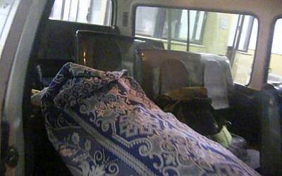 This image made from video provided by the Azaz Media Counsel purports to show the wrapped body of Japanese journalist Mika Yamamoto, who was killed in Aleppo on August 20 (photo credit: AP/Azaz Media Counsel via AP video)