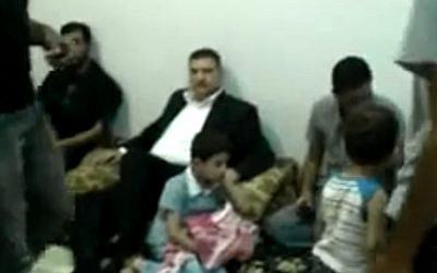 Defected Prime Minister Riad Hijab, center, before leaving Syria en route to Jordan in August (photo credit: AP/Shaam News Network)