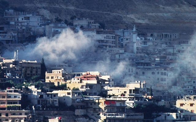 Smoke fills the air from shelling in Damascus, Syria on Wednesday (AP/Shaam News Network)
