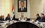 Riad Hijab heads a Syrian government meeting in an undated photo (photo credit: AP Photo/SANA)