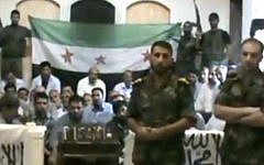 Free Syrian Army soldiers guarding a group of Iranians abducted on August 4, 2012 (photo credit: AP video/Baraa Brigades)