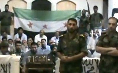 Free Syrian Army soldiers guarding a group of Iranians abducted on August 4, 2012 (photo credit: AP video/Baraa Brigades)