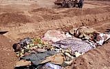 A citizen journalism image purports to show people killed by pro-government militiamen being buried in a mass grave in outside Damascus. (photo credit: AP Photo/Shaam News Network, SNN)