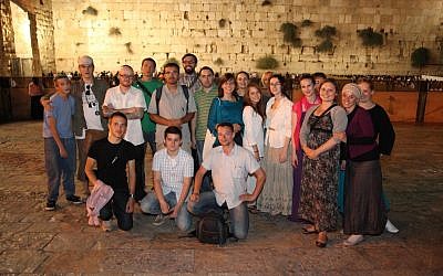 Young Poles with Jewish roots visit the Western Wall on Aug. 20, part of an organized trip intended to connect them with their heritage and Israel. (Photo credit: Mariusz Frej/Courtesy of Shavei Israel via JTA)