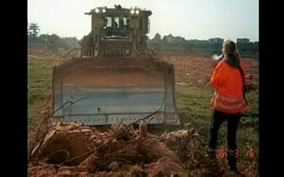Rachel Corrie faces a bulldozer in Gaza (photo credit: image capture journeymanpictures/Youtube) Rachel Corrie faces a bulldozer in Gaza (photo credit: image capture journeymanpictures/Youtube)