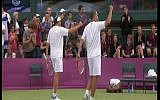 Israeli tennis duo Andy Ram and Jonathan Erlich celebrate after beating their Swiss rivals, Roger Federer and Stanislas Wawrinka, to make it to the quarterfinals in London (image capture Channel 1)