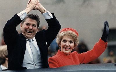 President Ronald Reagan, pictured with wife Nancy at his 1981 inauguration, is credited in a draft of the Republican Party platform as the source of a quotation by Rabbi Hillel. (Photo credit: From http://commons.wikimedia.org/wiki/File%3AThe_Reagans_waving_from_the_limousine_during_the_Inaugural_Parade_1981.jpg)