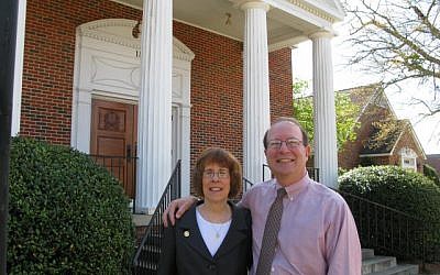 Rabbi Lynne Goldsmith and her husband, Rob Goldsmith, in front of their synagogue in Dothan, Alabama, where Jews can receive up to $50,000 for relocating there for at least five years. (Rob Goldsmith/JTA)