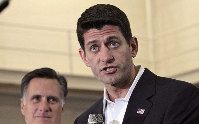 Republican presidential candidate Mitt Romney, left, listens as vice presidential running mate Rep. Paul Ryan, R-Wis., speaks at a rally at the Randolph Macon college in Ashland, Virginia, Saturday. (photo credit: AP/Mary Altaffer)