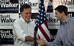 Republican presidential candidate, former Massachusetts Gov. Mitt Romney, left, shakes hands with US Rep. Paul Ryan, R-Wis., Chairman of the House Budget Committee, in March. (photo credit: AP/Steven Senne, File)