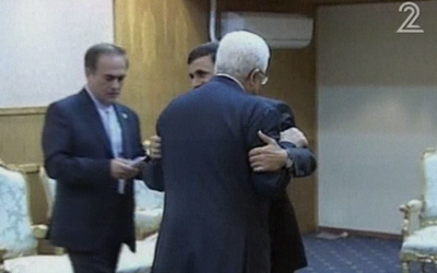 Iranian President Ahmadinejad hugs Palestinian President Mahmoud Abbas in Tehran on August 31. (photo credit: Image capture from Channel 2)