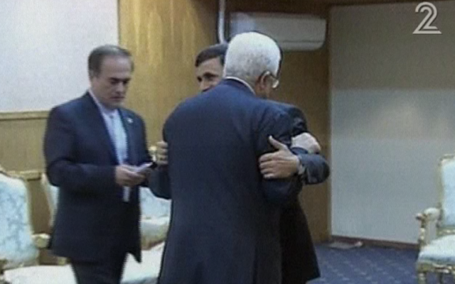 Former Iranian President Ahmadinejad hugs Palestinian Authority President Mahmoud Abbas in Tehran on August 31, 2012. ( Channel 2 screenshot)