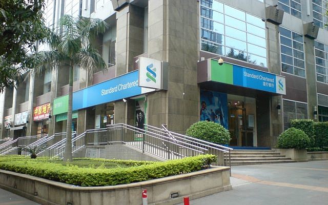 A Standard Chartered Bank branch in Guangzhou, China (photo credit: CC BY-SA Chintunglee, Wikipedia) A Standard Chartered Bank branch in Guangzhou, China (photo credit: CC BY-SA Chintunglee, Wikipedia)