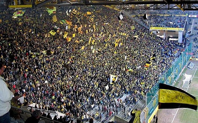 Fans at the Dortmund soccer stadium during a match (photo credit: CC BY Pascal Philp/Wikipedia)