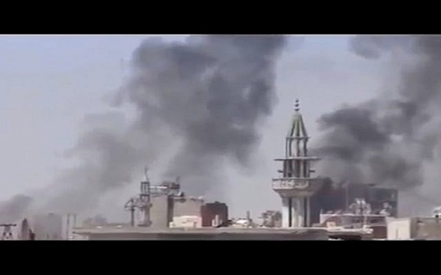 Smoke rises after regime shelling in Damascus (photo credit: screen capture highintheskyable/Youtube)