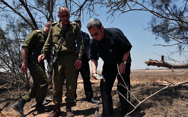 Defense Minister Ehud Barak and Gaza Division Commander Brig. Gen. Yossi Bachar on Monday at the scene of Sunday's attack (Photo credit: Courtesy: Defense Ministry) Defense Minister Ehud Barak and Gaza Division Commander Brig. Gen. Yossi Bachar on Monday at the scene of Sunday's attack (Photo credit: Courtesy: Defense Ministry)
