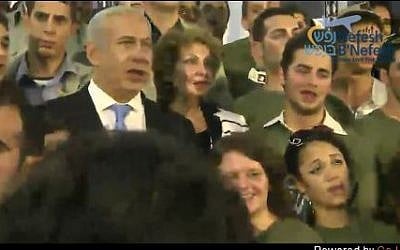 Prime Minister Netanyahu and Minister of Immigrant Absorption Landver are joined at the end of Tuesday morning's ceremony in singing "Hatikva" by 127 new immigrants who are to enlist in the IDF. (photo credit: Screen shot, Nefesh B'Nefesh live feed)