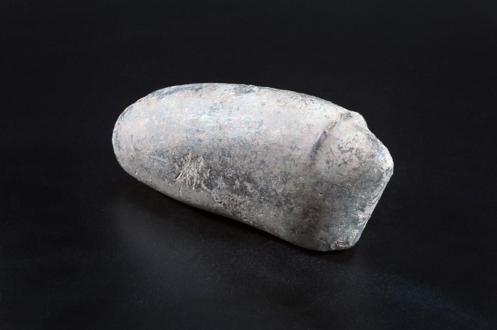 Archaeologists say this stylized figurine might depict a large, horned animal like a buffalo (photo credit: Yael Yolovich/Israel Antiquities Authority)