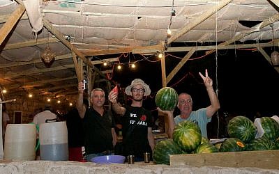 Benayun, Israeli and Ohayon working the watermelon stand (photo credit: Hamutal Wachtel) Benayun, Israeli and Ohayon working the watermelon stand (photo credit: Hamutal Wachtel)