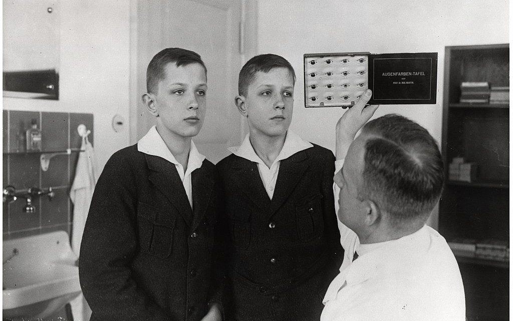 Dr. Otmar von Verschuer examines twins at the Kaiser Wilhelm Institute. As the head of the Kaiser Wilhelm Institute’s Department for Human Heredity, Verschuer, a physician and geneticist, examined hundreds of pairs of twins to study whether criminality, feeble-mindedness, tuberculosis, and cancer were inheritable. In 1927, he recommended the forced sterilization of the 'mentally and morally subnormal.' Verschuer typified those academics whose interest in Germany’s 'national regeneration' provided motivation for their research.
(Photo credit: Archiv zur Geschichte der Max-Planck-Gesellschaft, Berlin-Dahlem) Dr. Otmar von Verschuer examines twins at the Kaiser Wilhelm Institute. As the head of the Kaiser Wilhelm Institute’s Department for Human Heredity, Verschuer, a physician and geneticist, examined hundreds of pairs of twins to study whether criminality, feeble-mindedness, tuberculosis, and cancer were inheritable. In 1927, he recommended the forced sterilization of the 'mentally and morally subnormal.' Verschuer typified those academics whose interest in Germany’s 'national regeneration' provided motivation for their research.
(Photo credit: Archiv zur Geschichte der Max-Planck-Gesellschaft, Berlin-Dahlem)