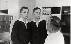 Dr. Otmar von Verschuer examines twins at the Kaiser Wilhelm Institute. As the head of the Kaiser Wilhelm Institute’s Department for Human Heredity, Verschuer, a physician and geneticist, examined hundreds of pairs of twins to study whether criminality, feeble-mindedness, tuberculosis, and cancer were inheritable. In 1927, he recommended the forced sterilization of the 'mentally and morally subnormal.' Verschuer typified those academics whose interest in Germany’s 'national regeneration' provided motivation for their research.
(Photo credit: Archiv zur Geschichte der Max-Planck-Gesellschaft, Berlin-Dahlem)
