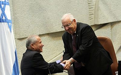 Knesset speaker Reuven Rivlin congratulates incoming Home Front Defense Minister Avi Dichter on Thursday (photo credit: Yoav Ari Dudkevitch/Flash90)