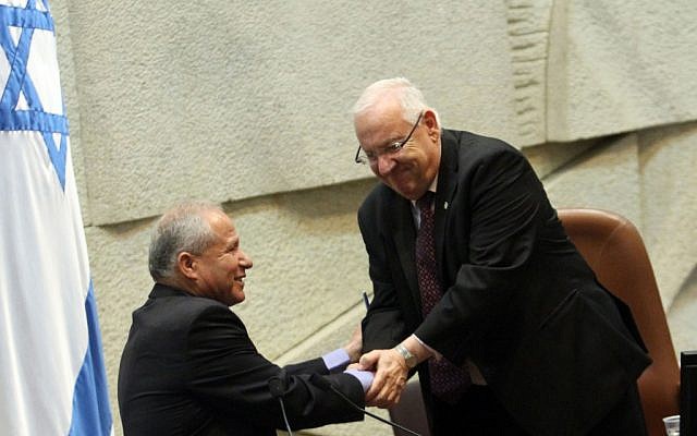 Knesset speaker Reuven Rivlin congratulates incoming Home Front Defense Minister Avi Dichter on Thursday (photo credit: Yoav Ari Dudkevitch/Flash90)