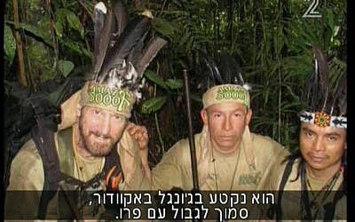 Grossman, left, in the jungle with his porters. (Screenshot: Channel 2)