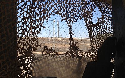 The view from an army post at Kerem Shalom. The grey tower marks the position where Gilad Shalit was captured in 2006. (photo credit: Times of Israel/Matti Friedman)