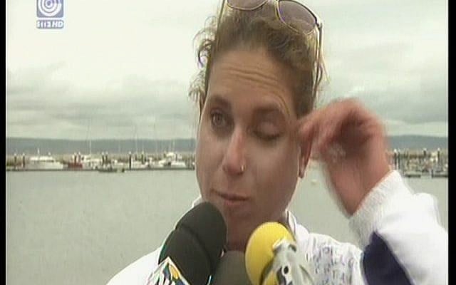 Lee Korzits wiping away a tear while speaking to reporters Tuesday. (Screenshot: IBA)