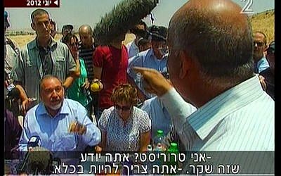 Taleb El Sana, back to camera, in a shouting match with Avigdor Liberman in June. (Screenshot: Channel 2)