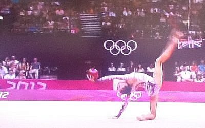 Rhythmic gymnast Neta Rivkin in action with the ball in the Olympic finals on Saturday (photo credit: Channel 1 screenshot)