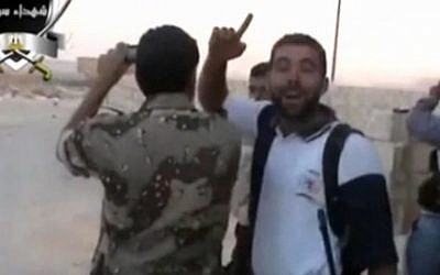 Syrian opposition fighters taking video or photo images of Syrian forces parachuting (photo credit: screenshot)