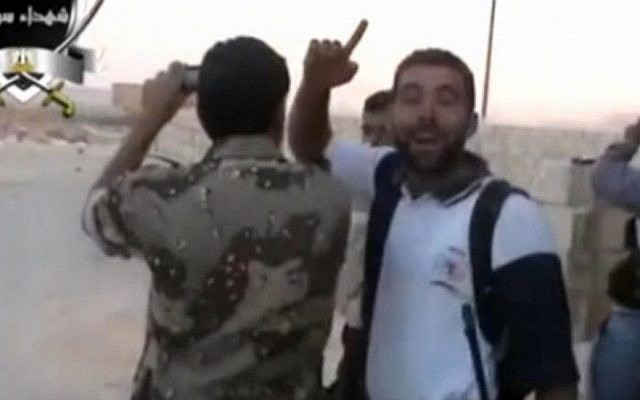 Syrian opposition fighters taking video or photo images of Syrian forces parachuting (photo credit: screenshot) Syrian opposition fighters taking video or photo images of Syrian forces parachuting (photo credit: screenshot)