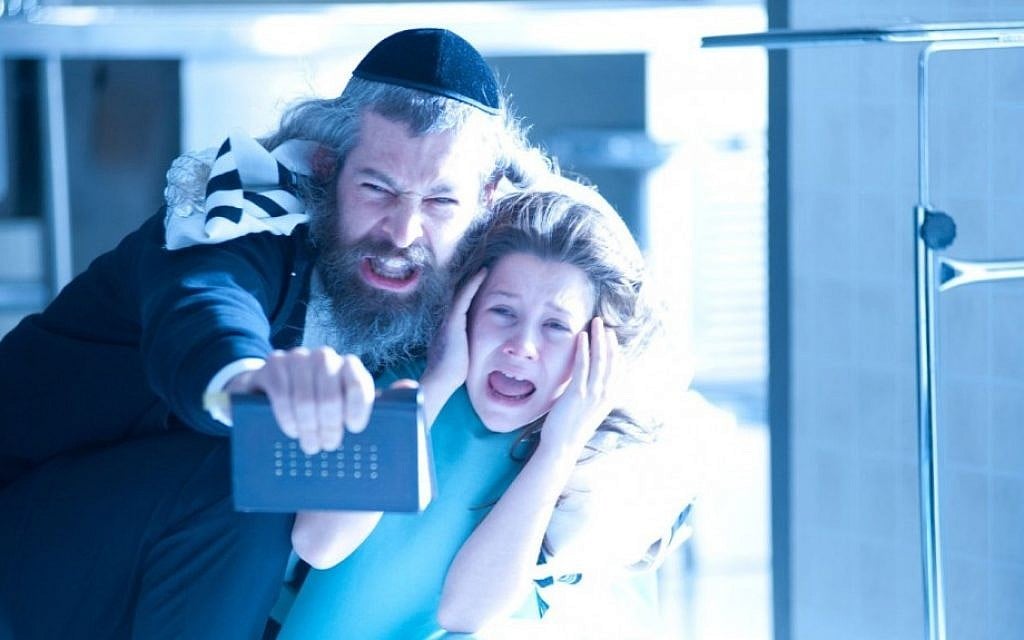 A rabbi's son (Matisyahu) attempts to exorcise a dybbuk, or malevolent spirit, from a young girl (Natasha Calis) in Hollywood thriller "The Possession" (Photo credit: courtesy of Lionsgate) A rabbi's son (Matisyahu) attempts to exorcise a dybbuk, or malevolent spirit, from a young girl (Natasha Calis) in Hollywood thriller "The Possession" (Photo credit: courtesy of Lionsgate)