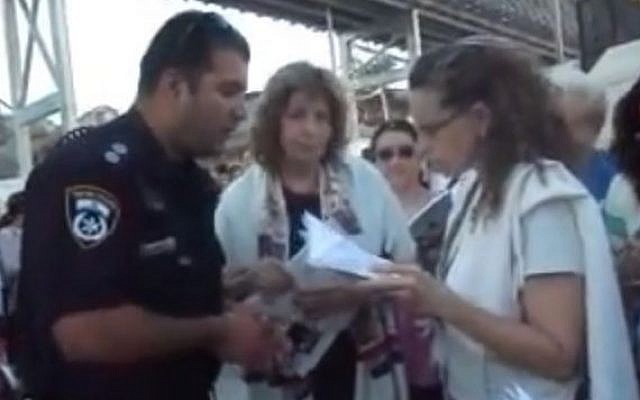 A still from a video clip uploaded by the Women of the Wall allegedly showing their members being arrested at the Western Wall (photo credit: YouTube screen capture)