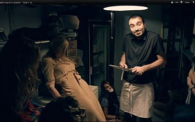 A semi-drugged Bar Refaeli and her captor in a MyCheck commercial. (photo credit: Image capture from video uploaded to YouTube by roykafri)