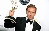 Actor Damien Lewis, winner of the Outstanding Lead Actor In A Drama Series award for "Homeland," poses backstage at the 64th Primetime Emmy Awards on Sunday, Sept. 23, 2012, in Los Angeles. (photo credit: Jordan Strauss/Invision/AP)